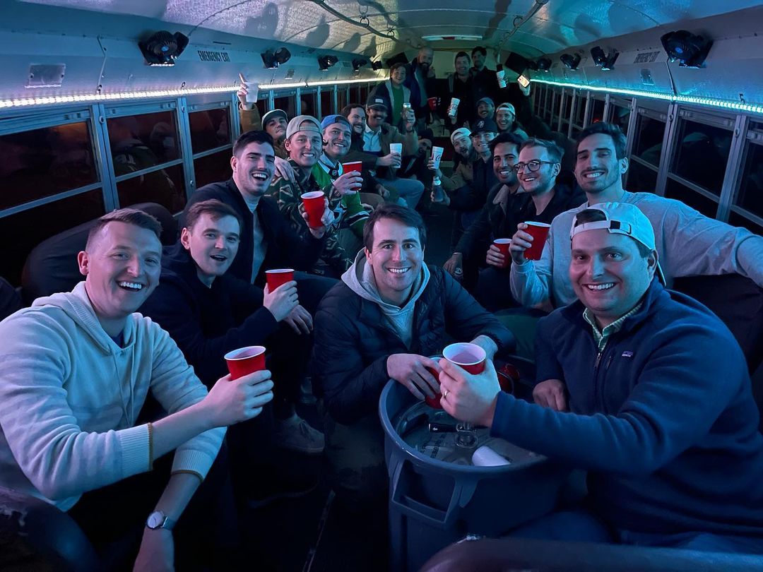 bachelor party group in a Fly-Rides party bus at night in Austin, Texas